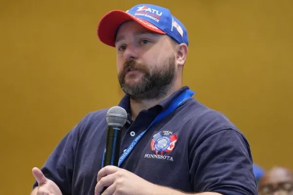 Funny Looking Guy Holding a MIC