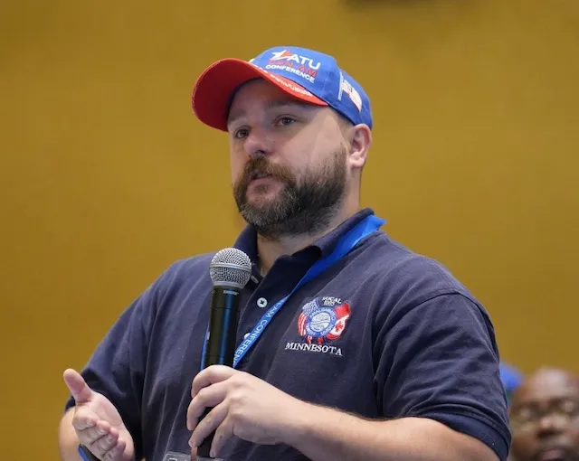 Funny Looking Guy Holding a MIC